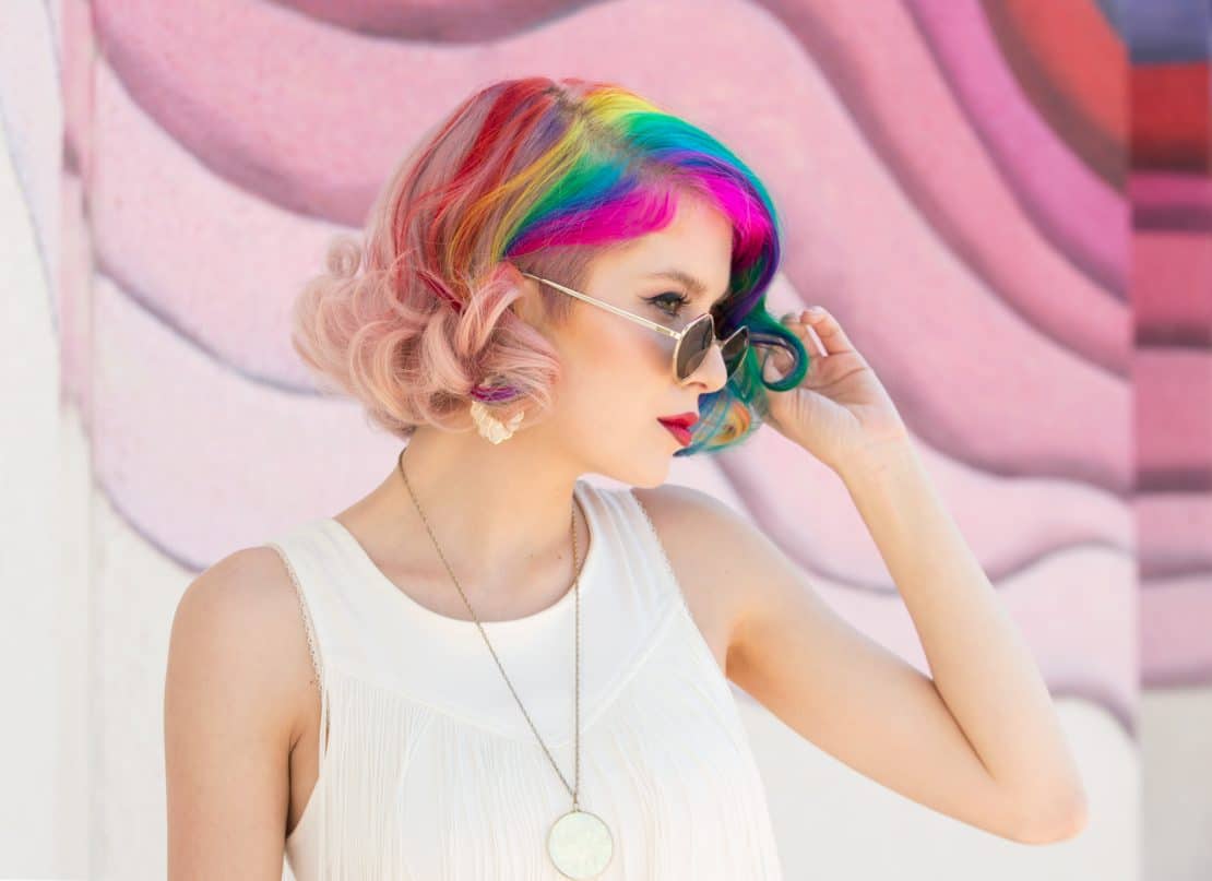 Using colorful backdrops is a creative way to make a professional portrait photography.